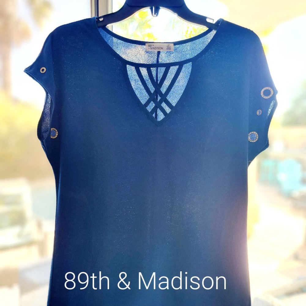 Blue short sleeve with peek a boo cutouts and and crystal inlays on sleeve